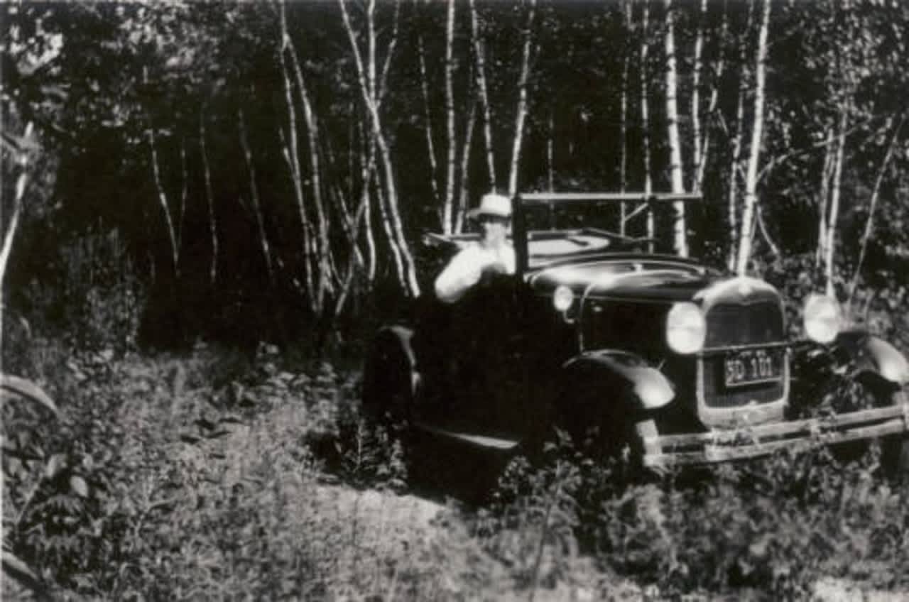 Franklin D. Roosevelt relaxes after a drive in 1932 at Springwood, his lifelong home in Hyde Park.