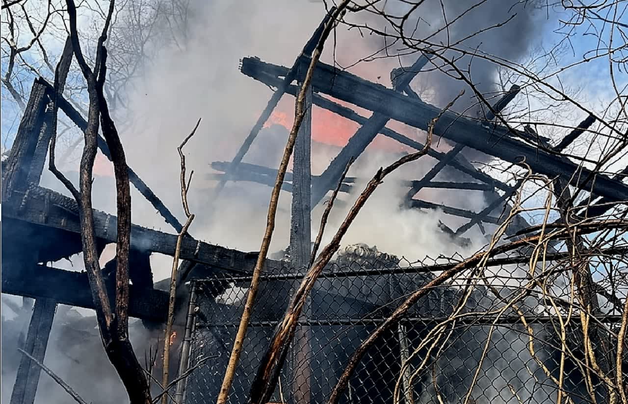 The fire on the hill overlooking Greenwood Lake in West Milford on Saturday, March 18, destroyed one home, damaged two others and sent two firefighters to the hospital.
