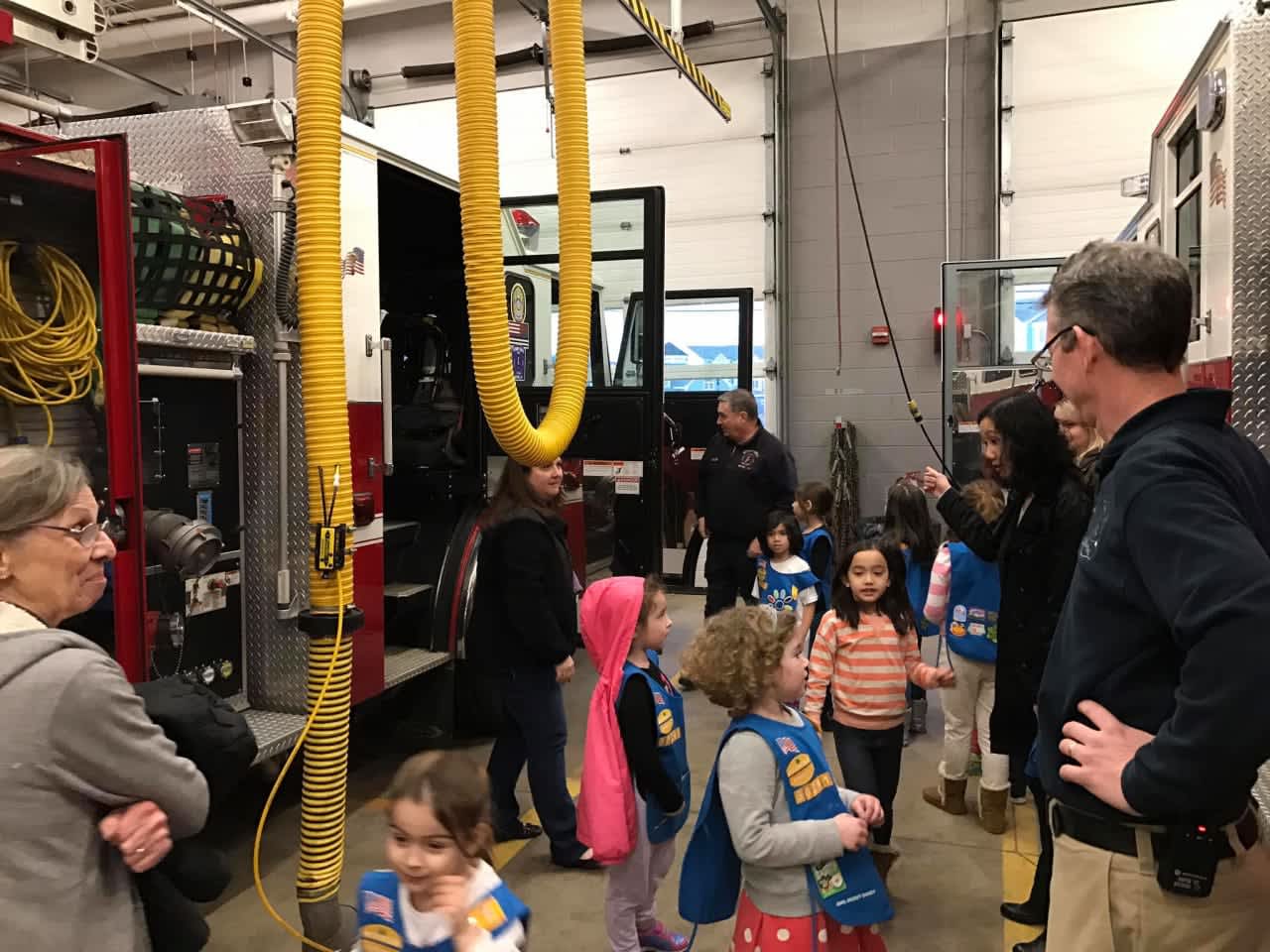Children in Daisy Girl Scout Troop 50261 ask questions of the firefighters on a recent trip to the Stony Hill Fire Department.