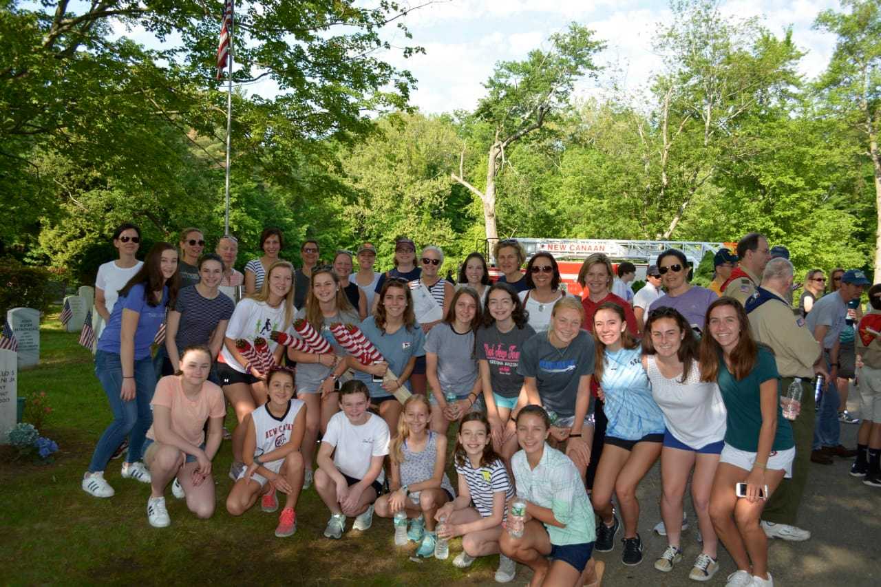 Volunteers from the New Canaan Chapter of the National Charity League at the Lakeview Cemetery on May 27.