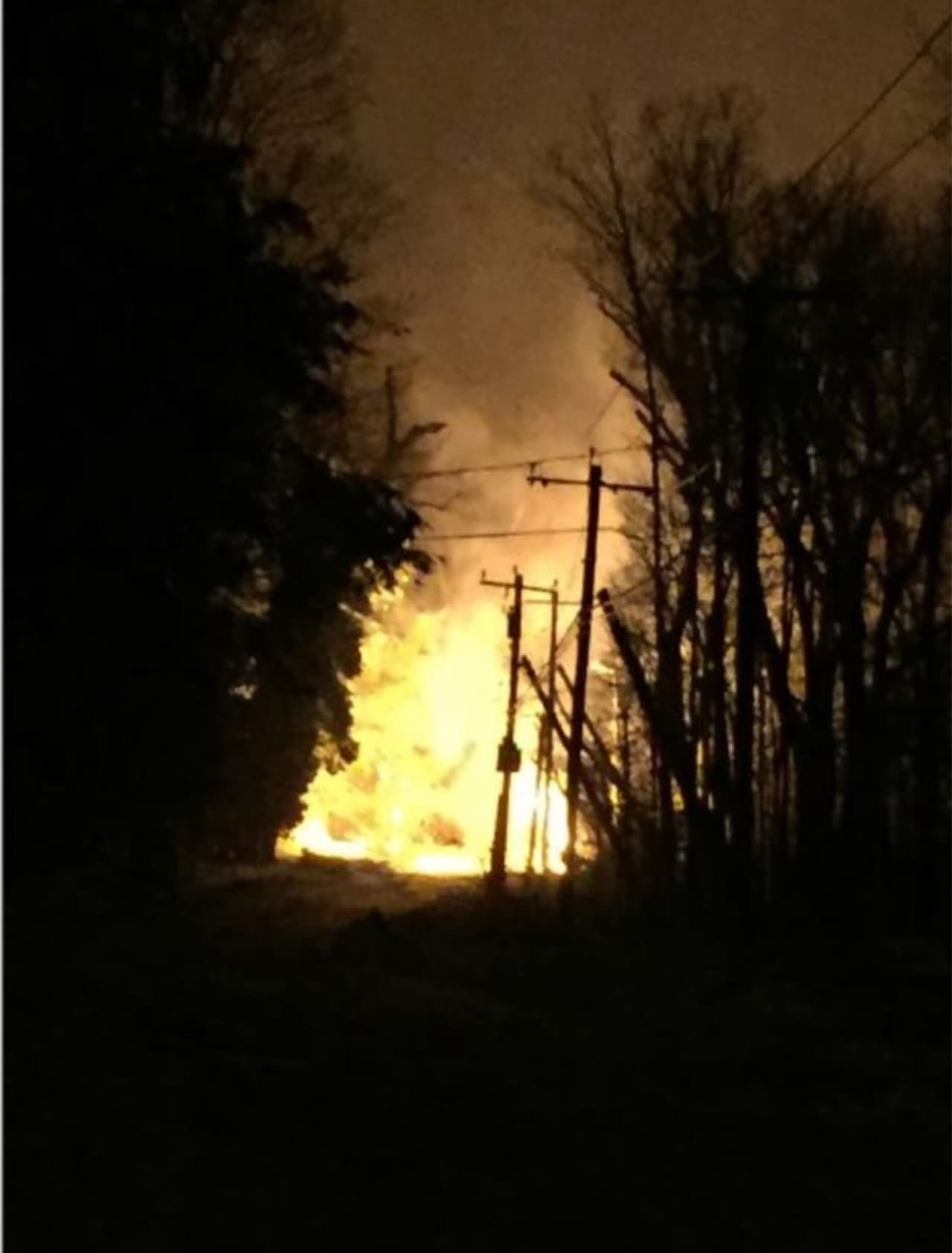 Downed power lines caught fire in New Canaan on Wednesday night.