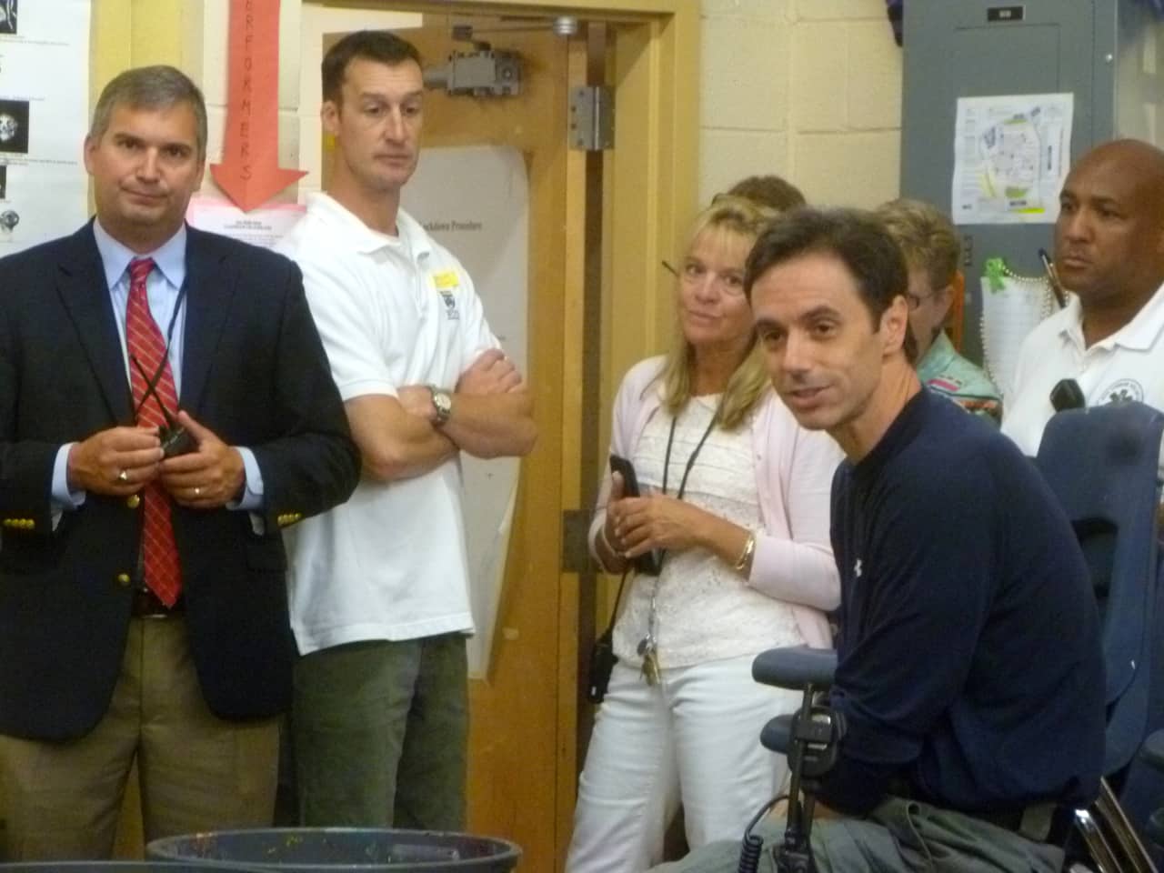 Michael Handler, right, breaks down a classroom lockdown drill in which teachers and other school employees played students hiding in a classroom. 