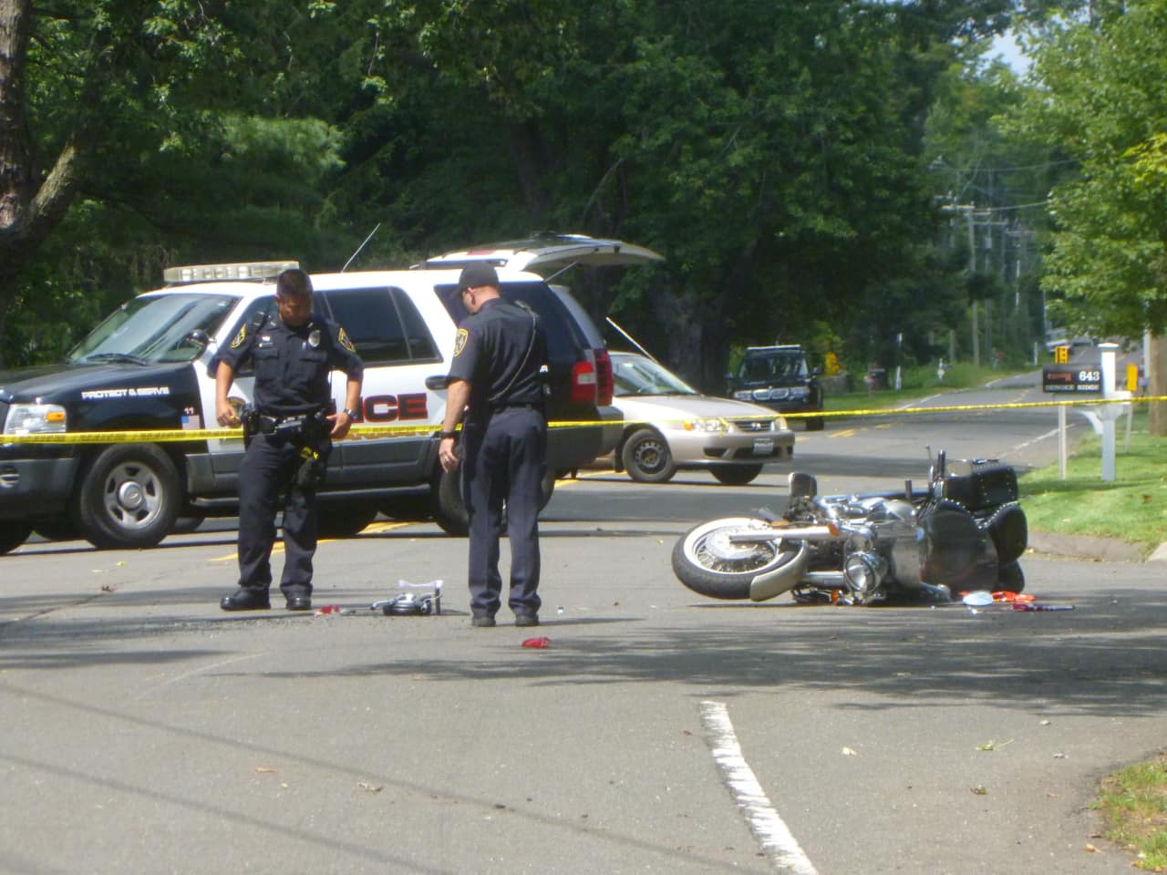 Police officers were on scene investigating a motorcycle crash at the intersection of Country Club Road and Oenoke Ridge in New Canaan. 