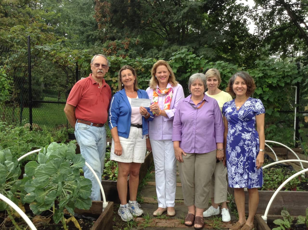 The New Canaan Garden Club donated money to help the garden at the Food Pantry at St. Mark's Episcopal Church in town. See story for IDs. 