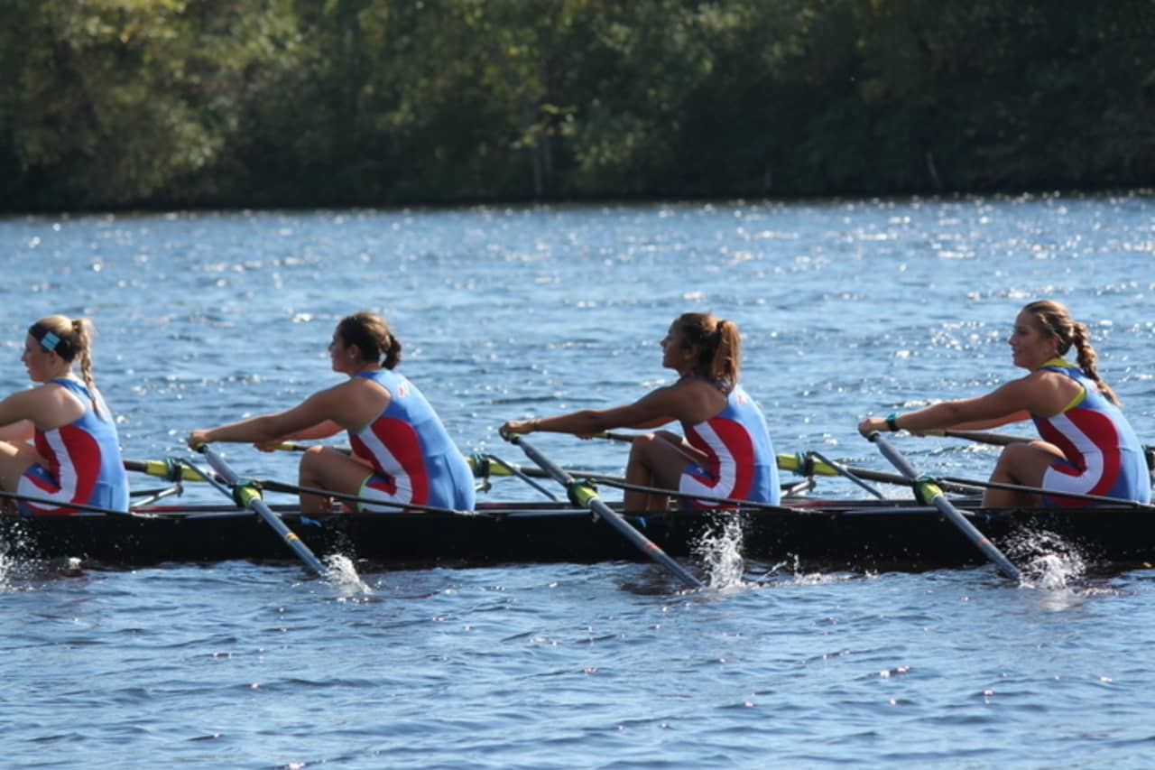 Girls on the Norwalk River Rowing Association pull during the Head of the Merrimack regatta last weekend in Massachusetts.
