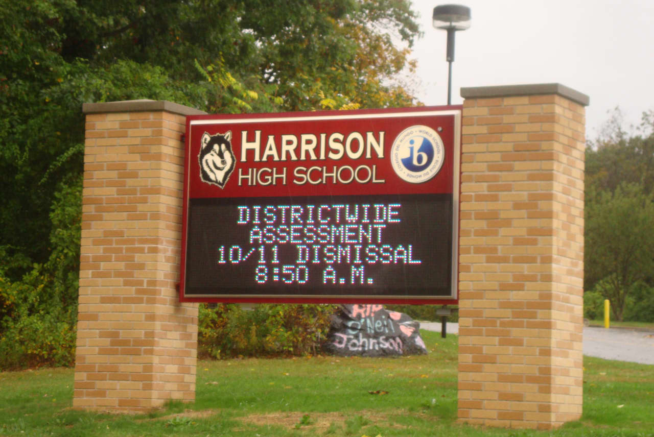 Electronic signs like this one outside Harrison High School could be used for corporate advertising as a way to generate more money for the town.