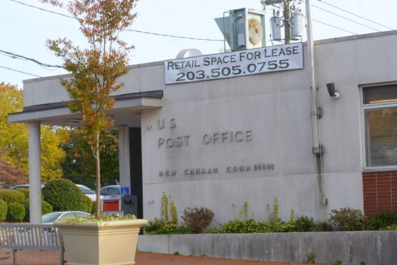 The United States Postal Service says it has not forgotten its commitment to stay in New Canaan. 