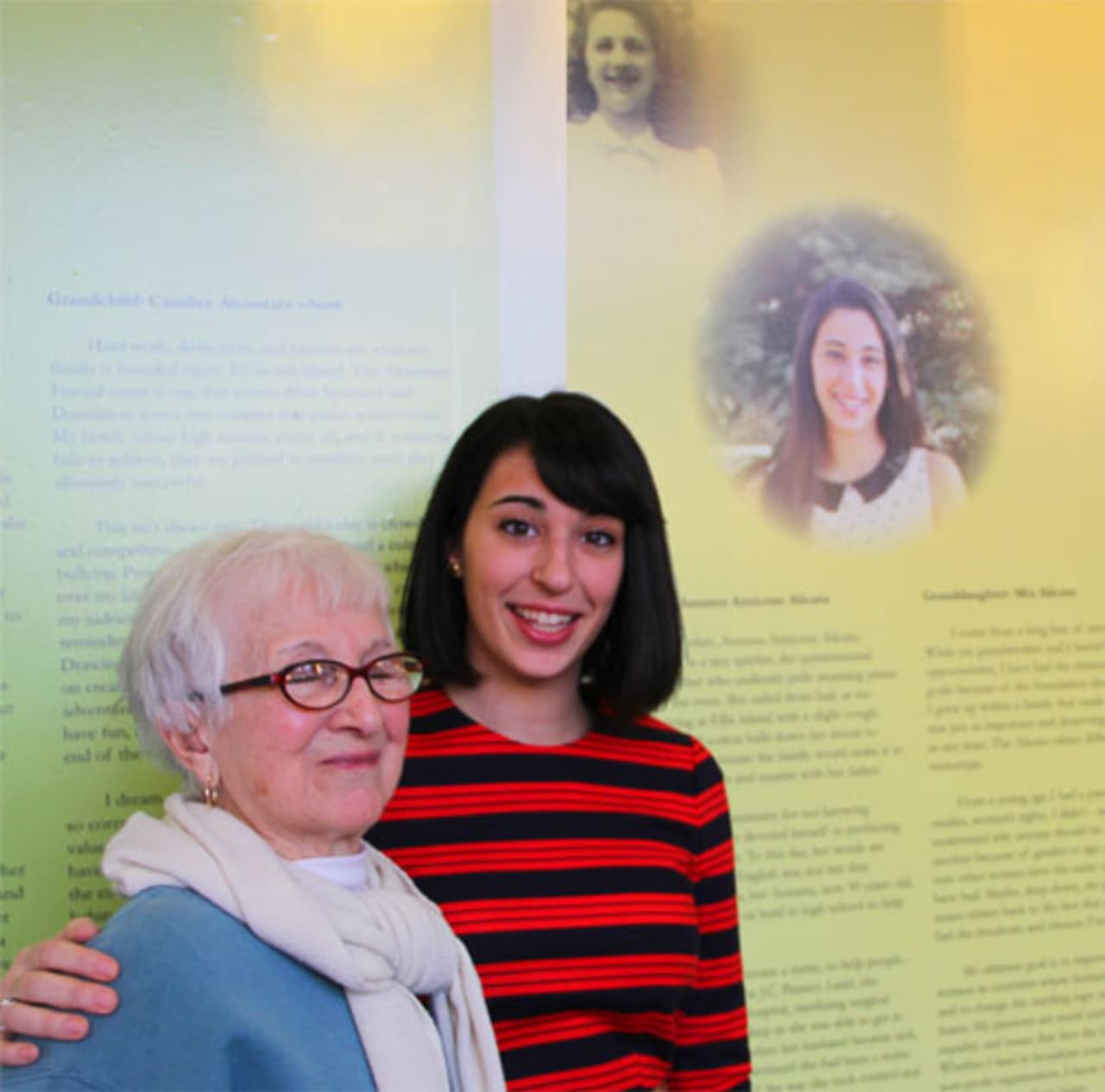 Manhattanville student Mia Alicata shows her grandmother Assunta Amicone Alicata her panel on the Living the Dream display at Manhattanville College.