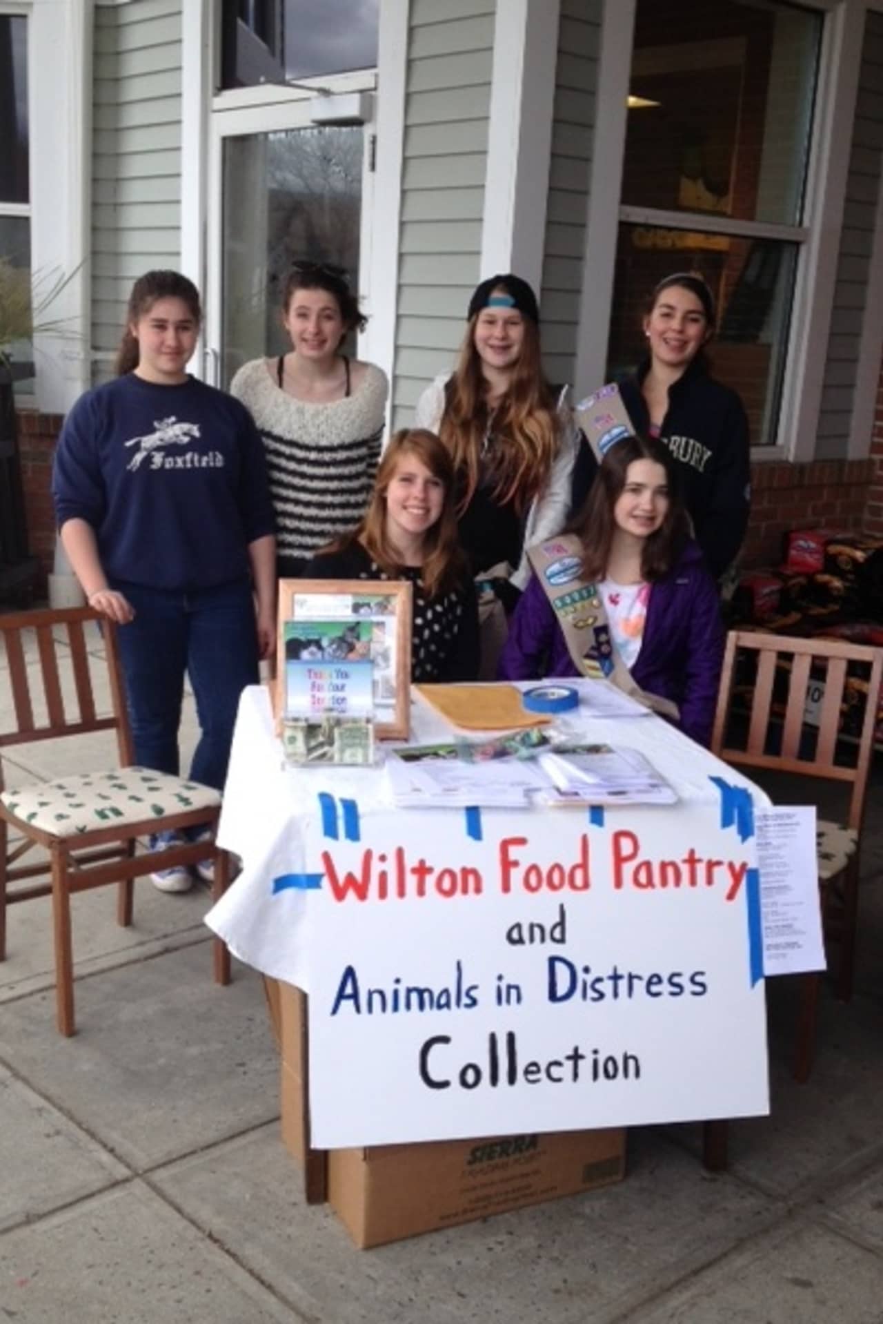 Members of Girls Scout Troop 50087 in Wilton collected donations for the food pantry and Animals In Distress Sunday at Stop and Shop.