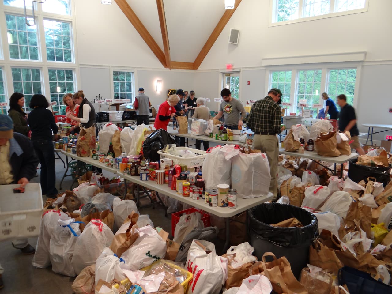 Volunteers sort food donations at Person-2-Person in Darien.