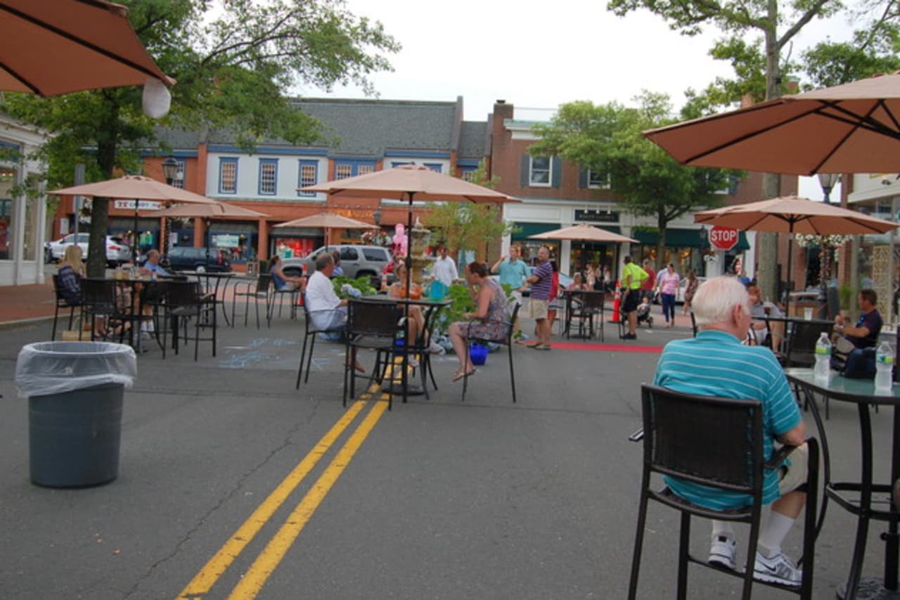 Diners enjoy the downtown Pop Up Park in New Canaan in a past year. 