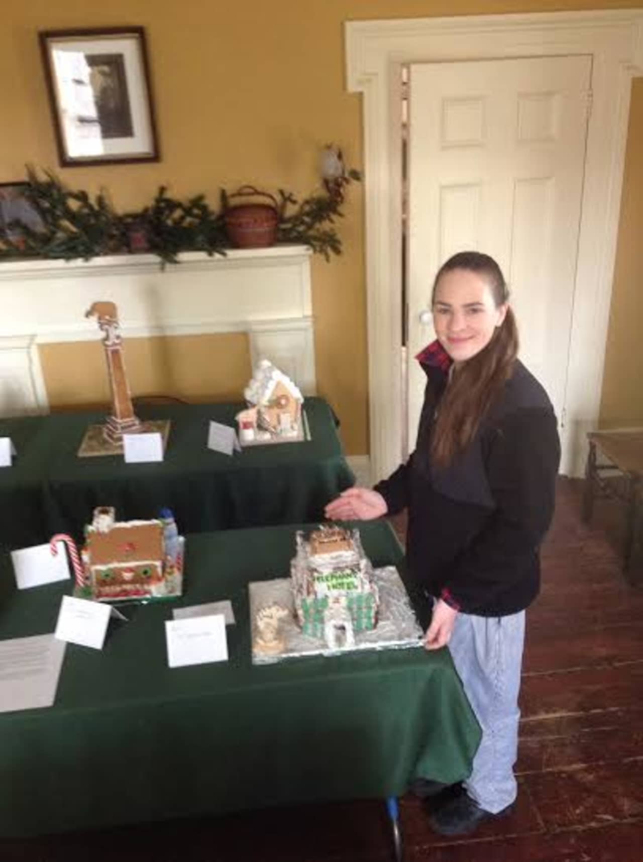 Pastry Chef Patrice Lovell with The Elephant Hotel gingerbread house, recipient of the Pastry Chef award in the Somers Historical  Society Gingerbread festival.