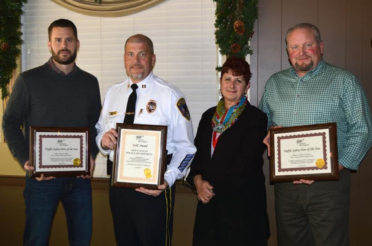 Fran Mayko, AAA public affairs manager , second, right, presented Capt. Vince DeMaio, second, left, with a Gold Award, and Officer Tom Patten, left, and Officer Geoff Lambbert, right, with Traffic Safety Hero Awards.