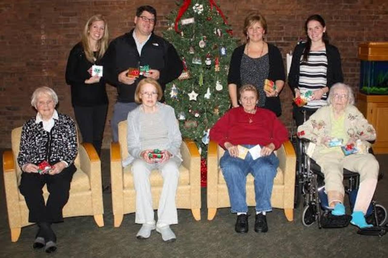 Pennweights of New Canaan donated gifts to Waveny LifeCare Network for the holidays. See story for IDs.