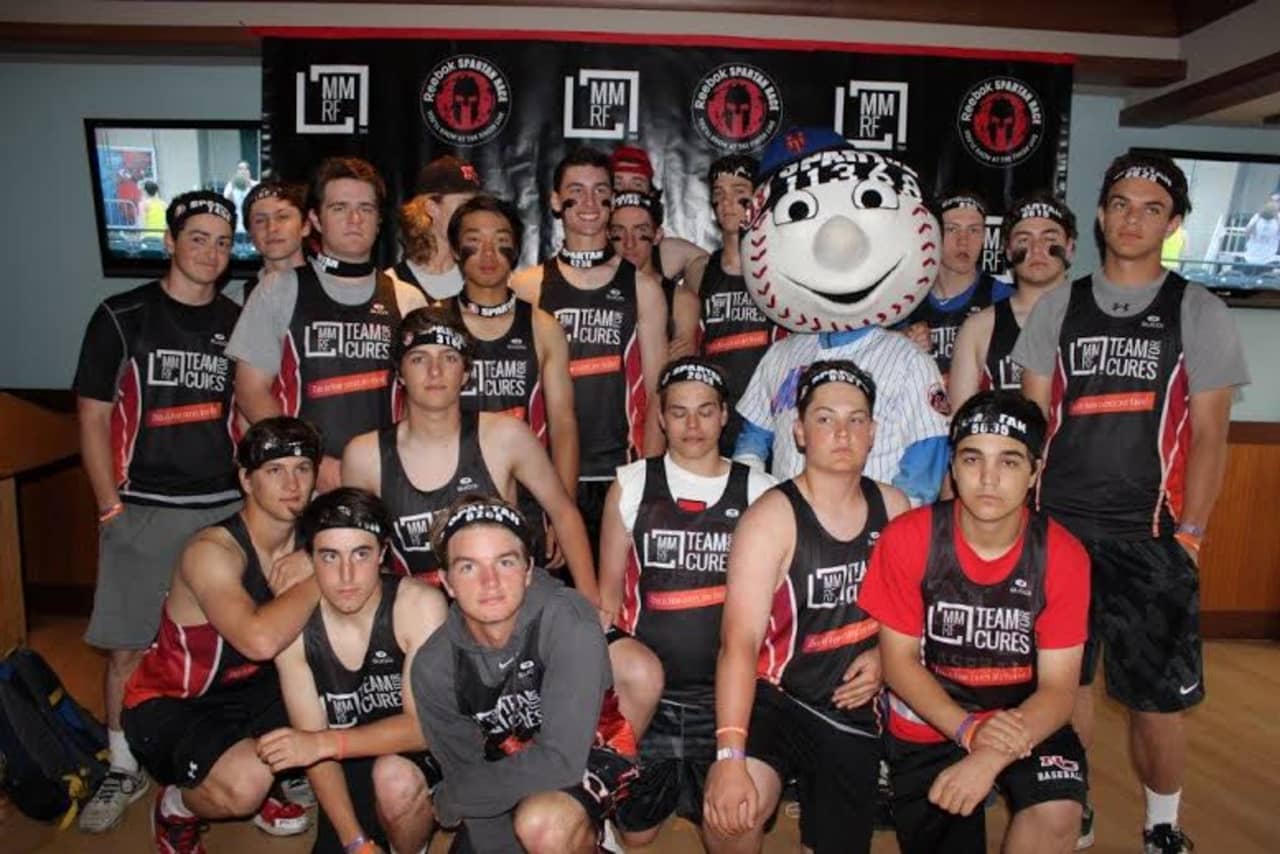 The New Canaan High School baseball team, with Mr. Met, ran in the Spartan Race Sunday at Citi Field to raise money for the Multiple Myeloma Research Foundation.