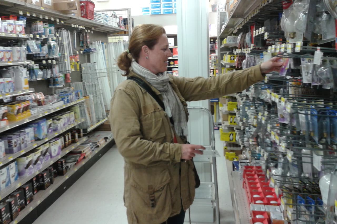 Melanie McGuire of New Canaan shops at Weed & Duryea on Thursday. She knows she'll have to get a few more supplies before Hurricane Sandy hits the area early next week. 