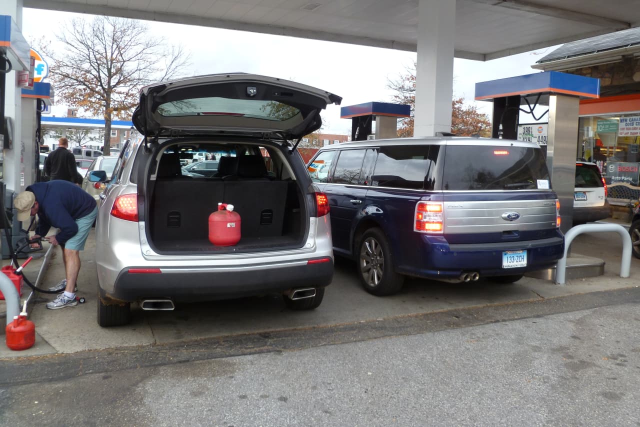 Cars and gas cans were being filled nearly nonstop on Thursday at the New Canaan Gulf Station on South Avenue. 