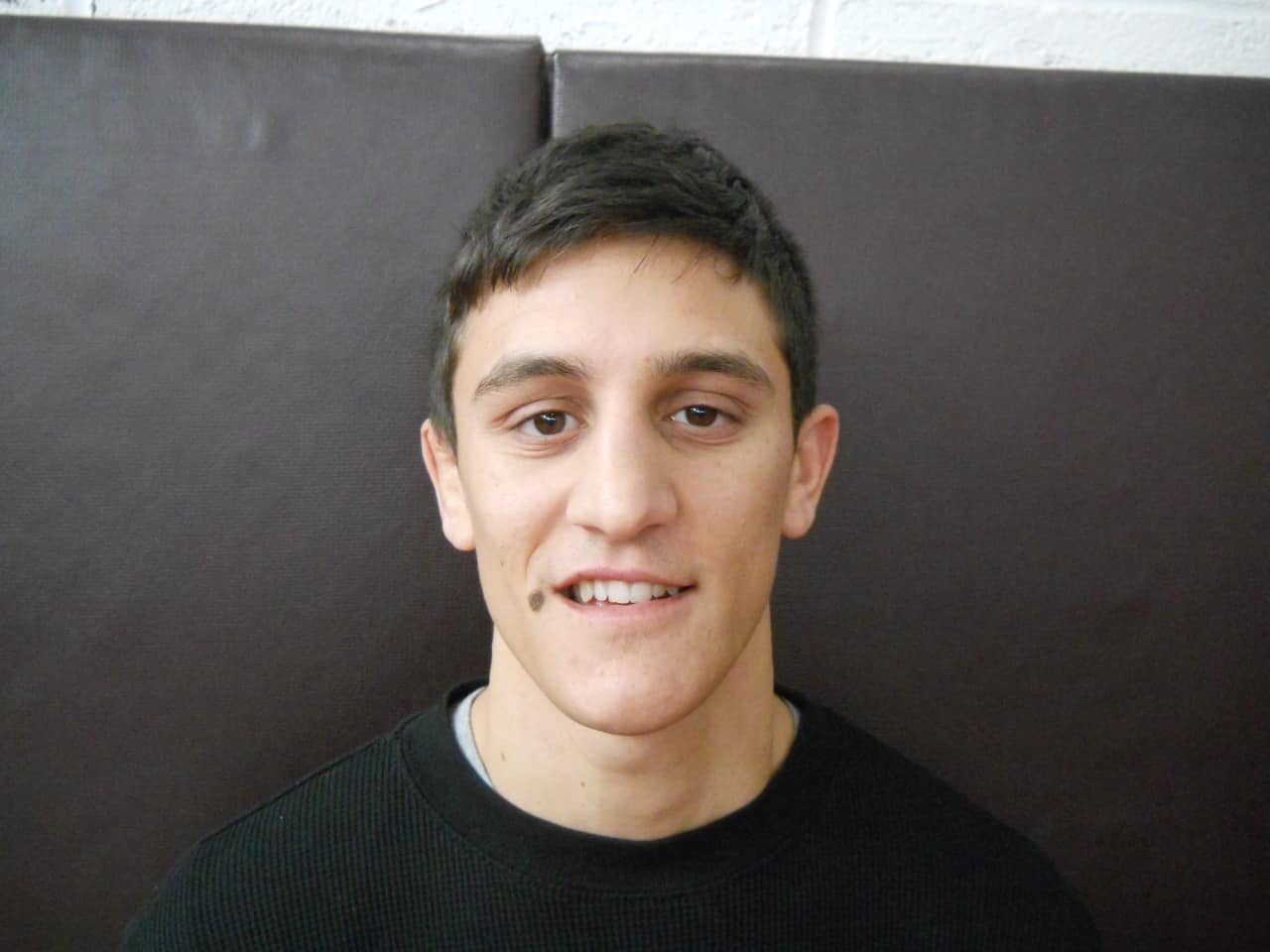Former three-time Section 1 wrestling champion Mark Arcara has returned to Harrison as the varsity assistant wrestling coach.