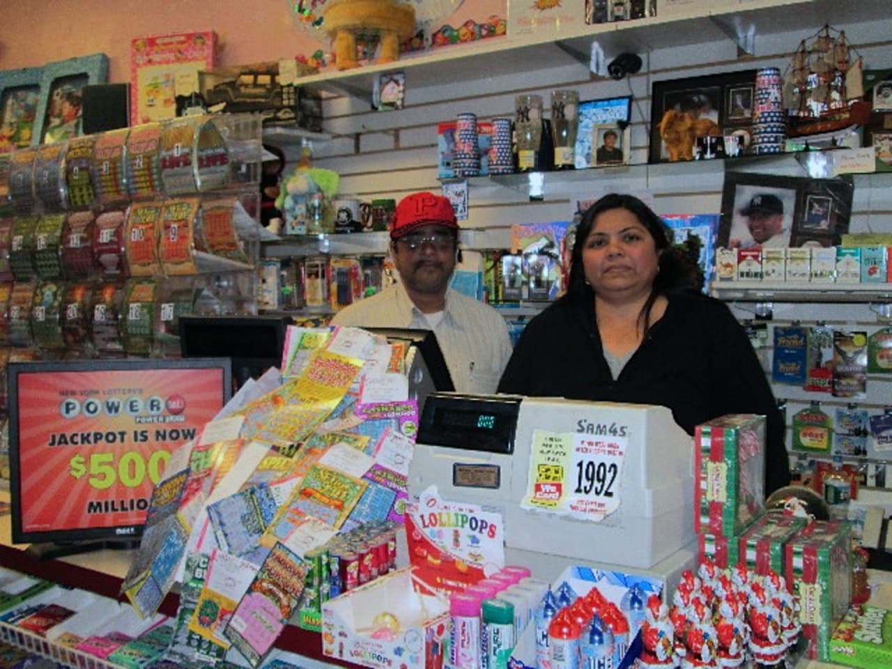 Nisha Kenia, right, owner of Candyland in Bronxville, said Bronxville residents have been buying Powerball tickets even in the snow.