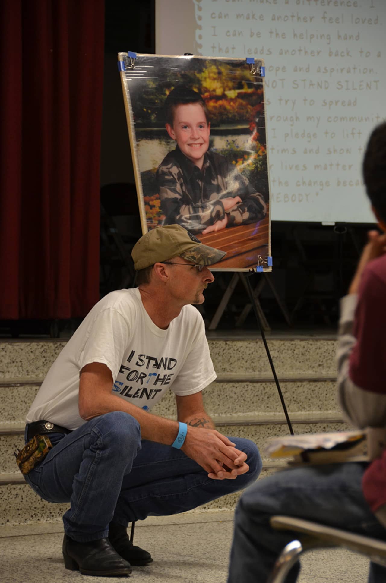 Kirk Smalley speaks Thursday at an AMD assembly featuring an anti-bullying program known as Stand For The Silent. 