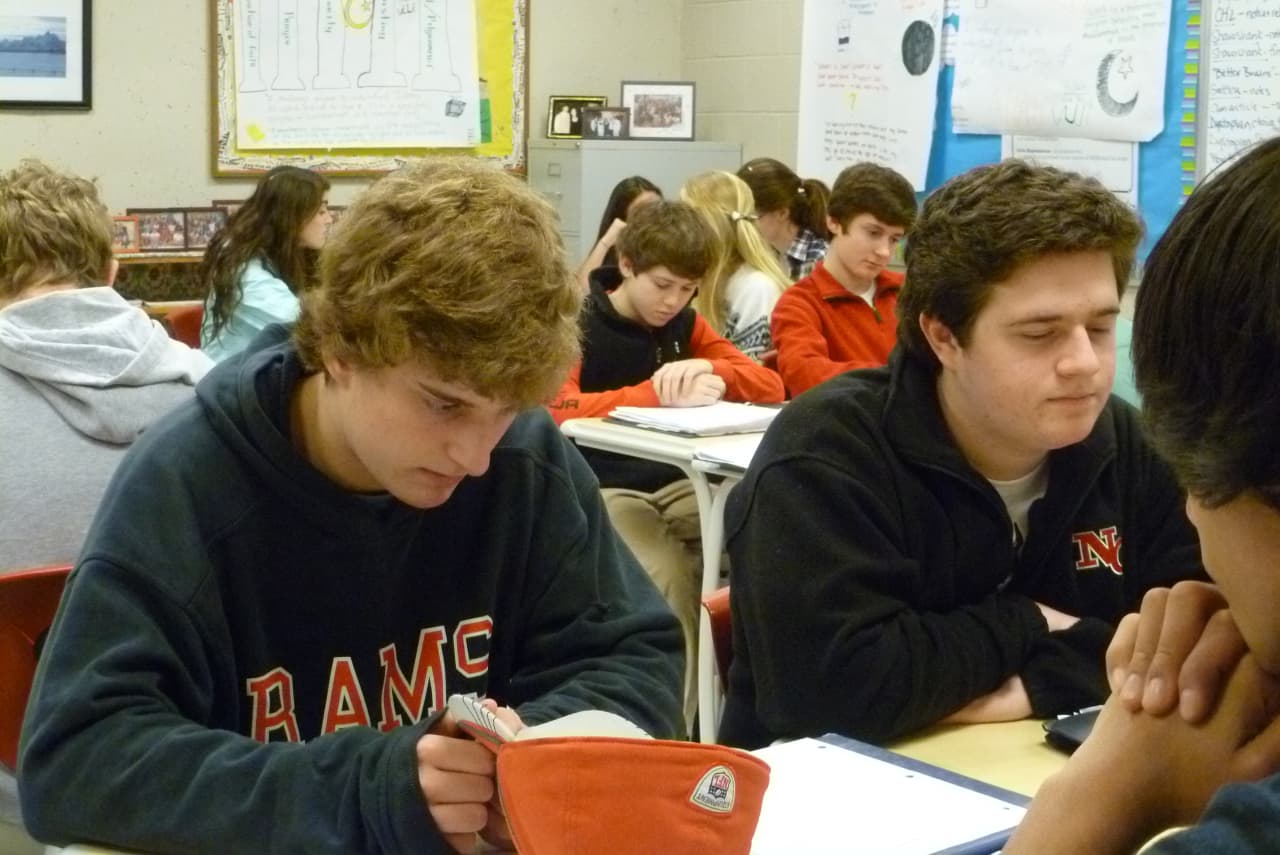 Students in Susan Steidl's class at New Canaan High School observe a moment of silence to remember the victims of the tragedy at Sandy Hook Elementary School in Newtown. 
