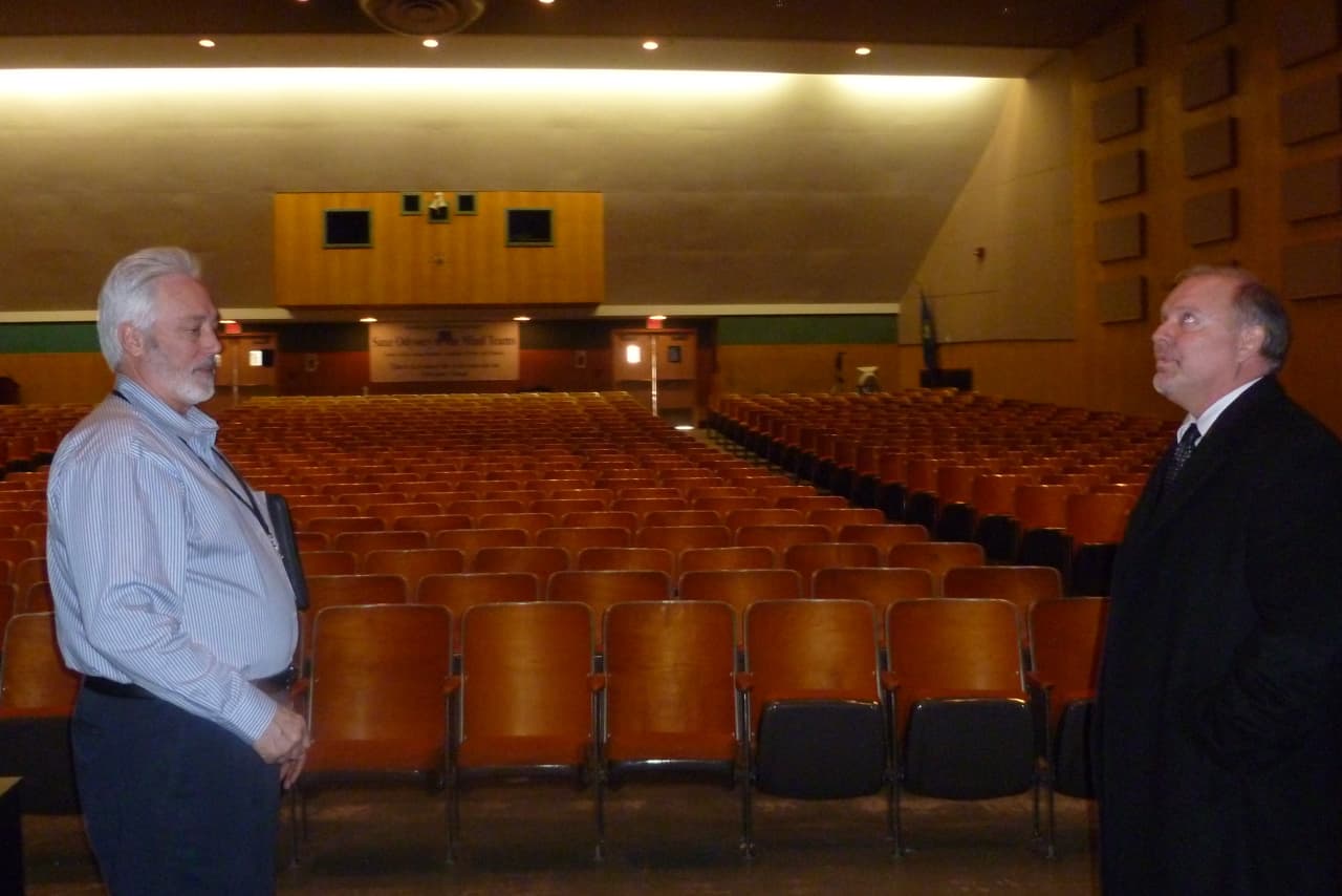New Canaan Schools Facilities Director Bob Willoughby, left, and Visual and Performing Arts Director Alan Sneath meet inside the Saxe Middle School Auditorium. 