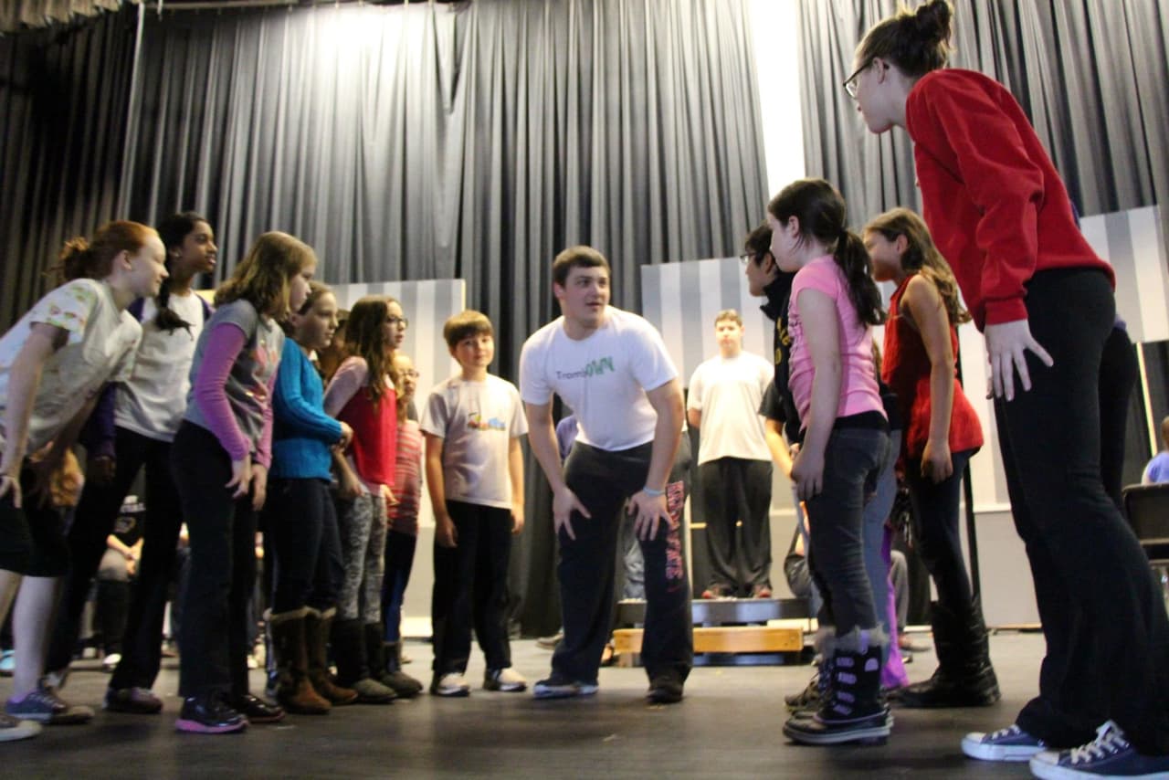Briarcliff High School drama students work with students from Todd Elementary School at a rehearsal for "The Music Man."