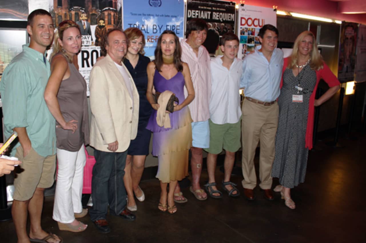Wilton resident and director Megan Smith-Harris, far right, stands with the cast of her critically-acclaimed documentary, "Trial by Fire: Lives Re-Forged." The film will premiere Saturday at the Wilton Library.