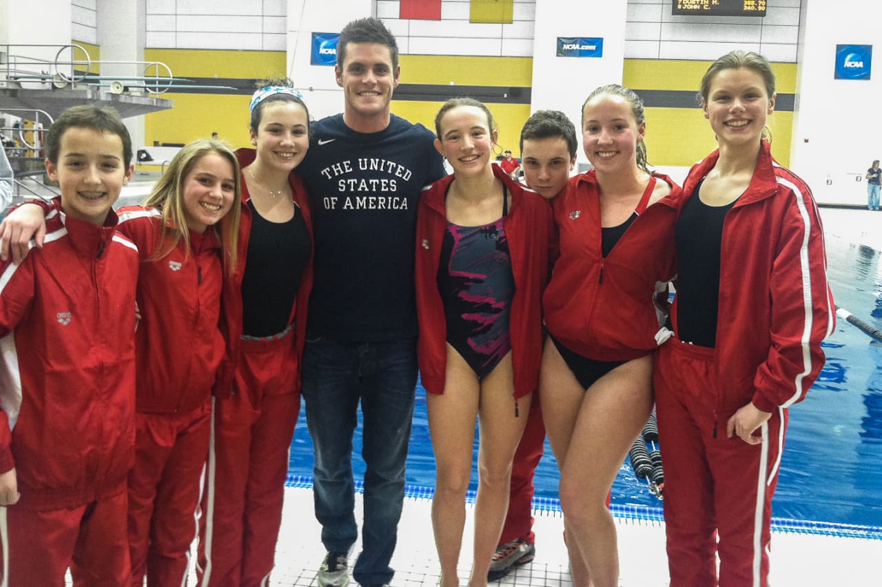 Members of Whirlwind Diving stand  with Olympic gold medalist, David Boudia.. From left are Timmy Luz, Anne Farley, Rachel Burston, David Boudia, Kylie Towbin, Sean Burston, Kirsten Parkinson, and Genevieve Angerame.