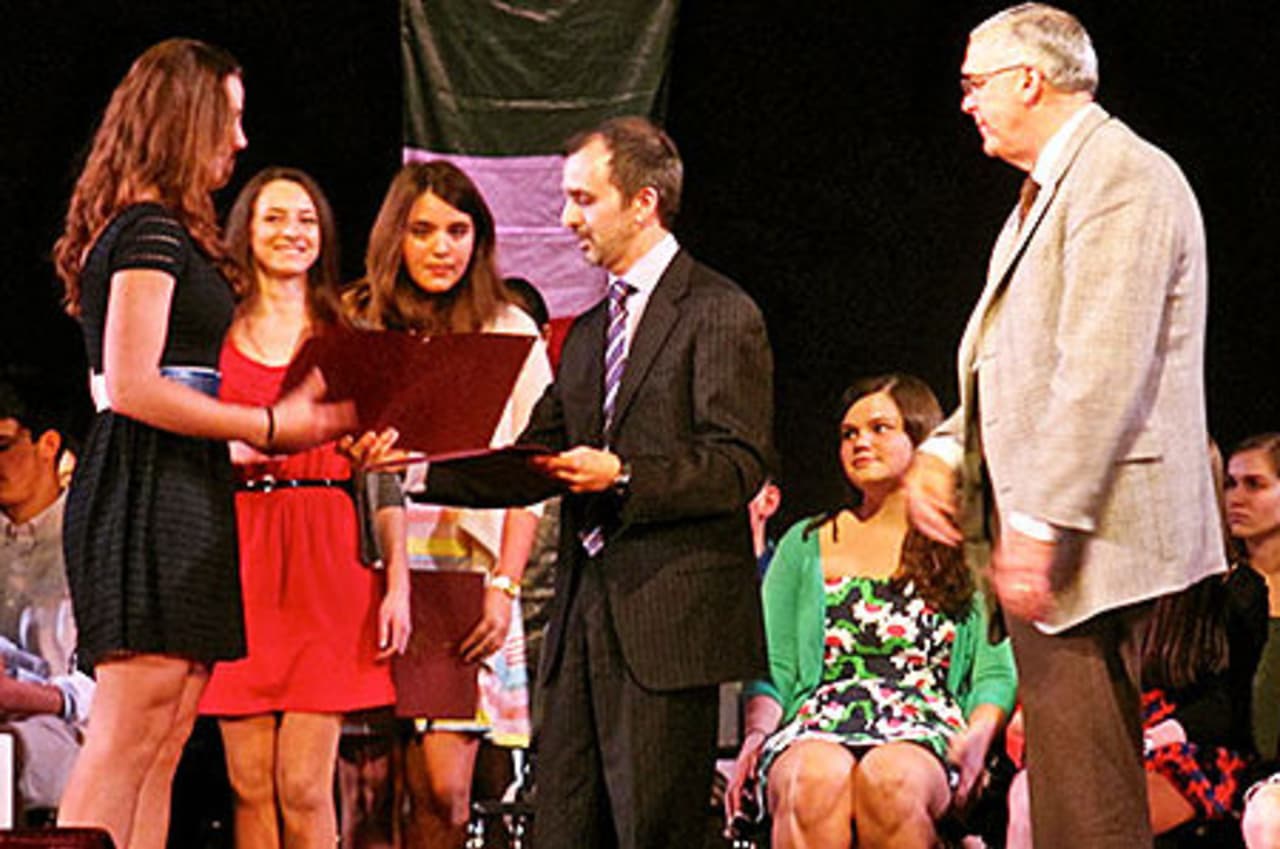 Harrison High School held a ceremony to induct 148 students into the National Foreign Language Honors Society.
