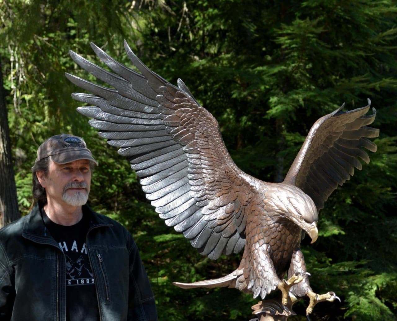 Idaho sculptor and Army veteran Mike Curtis stands with the "Tribute Eagle" he created for Somers' Lasdon Park in honor of all Westchester veterans.