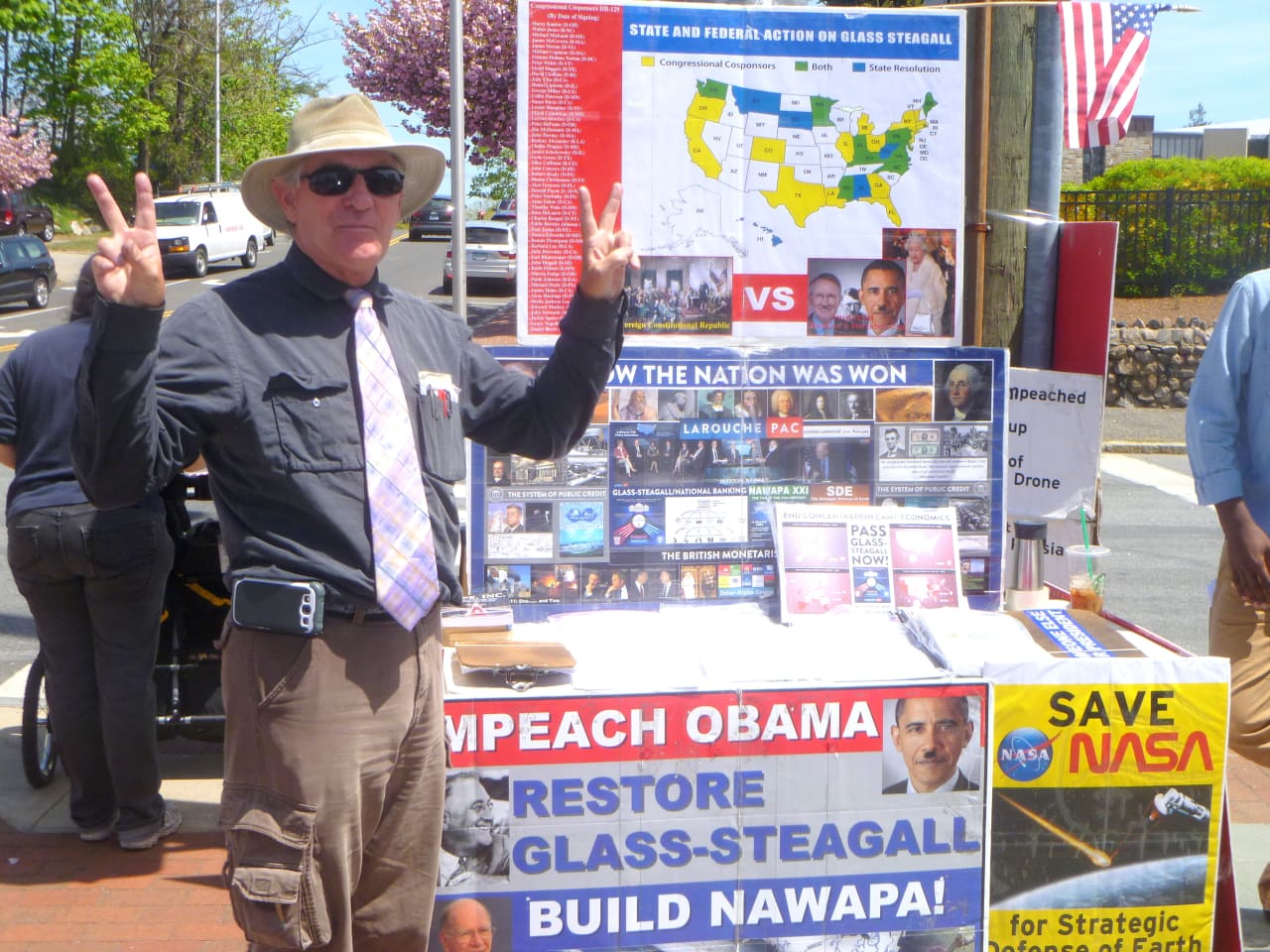 Matt Guice of the LaRouche Political Action Committee in New Canaan Tuesday trying to get people to call U.S. Rep. Jim Himes and tell him to support a bill to impeach the president. 