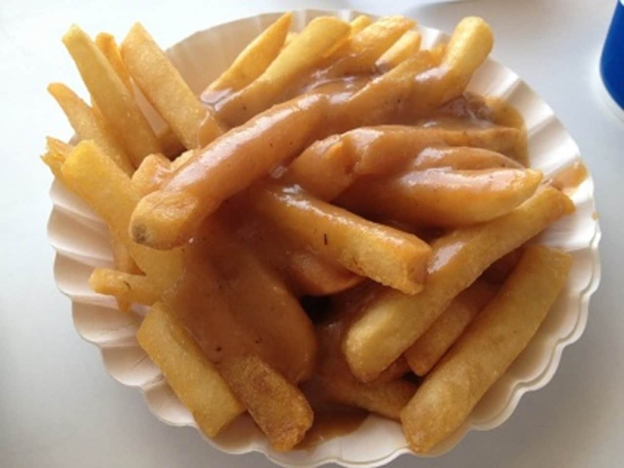 The gravy-soaked fries at Rutt's Hut in Clifton go good with their famous "rippers," hot dogs deep fried until their casings split and crack.