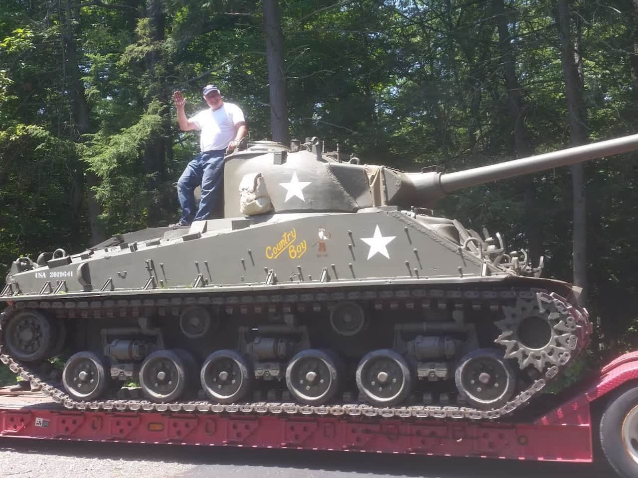 Bud Walker atop his World War II vintage Sherman tank, which will be on display with other Army vehicles at the Historic and Military Vehicles Show at Lasdon Park, Arboretum and Veterans Memorial, Saturday and Sunday, July 1 and 2.