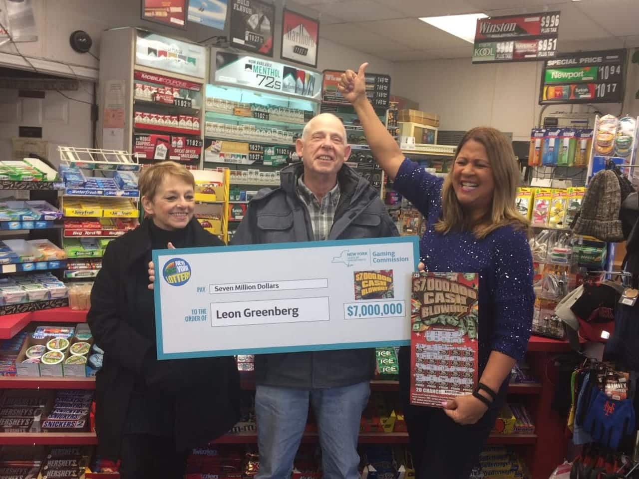 Ossining resident Leon Greenberg and his wife, Karin, at left, are introduced as $7 million New York State Lottery winners.
