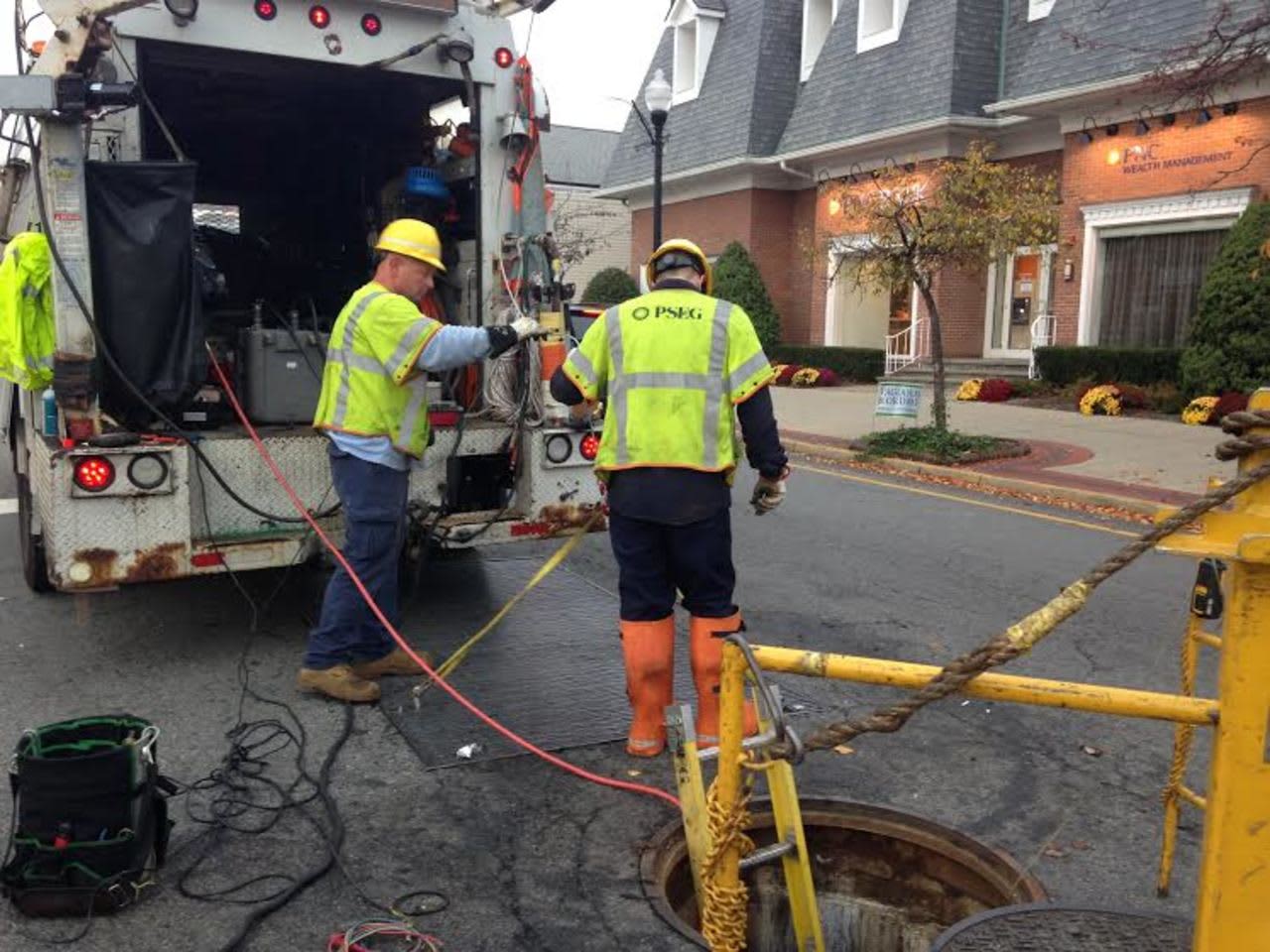 PSE&G workers descended into the manhole to check the electrical system in Ridgewood on Nov. 5.
