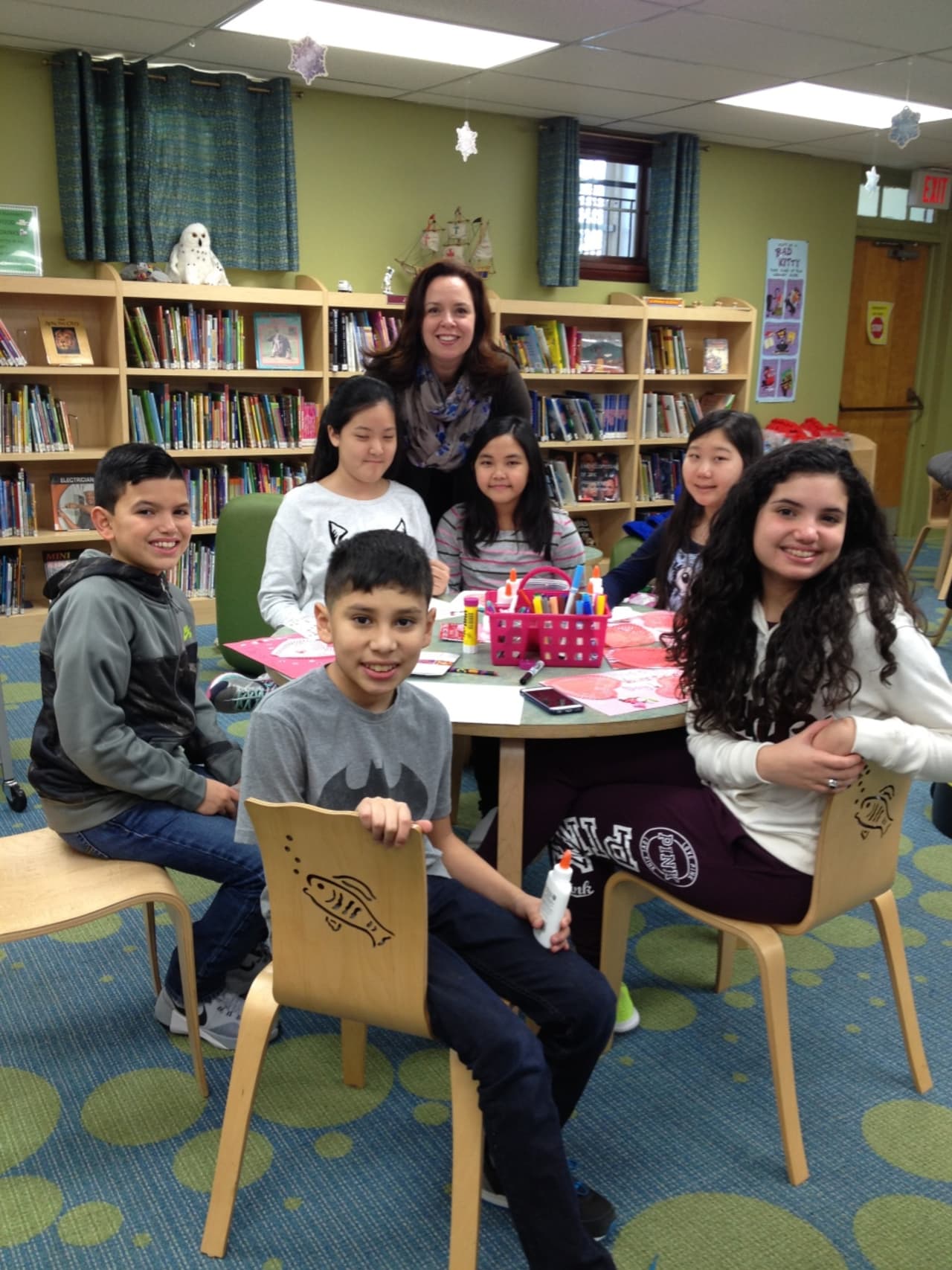Children's Librarian Maria Russo with some kids at East Rutherford Library.