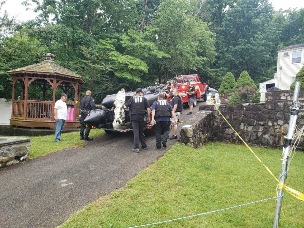 Searchers load up equipment after the search is ended.