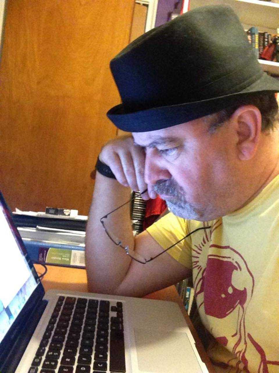 New Milford resident and Hackensack High School teacher Chris Ryan works diligently on his new book, "City of Pain."