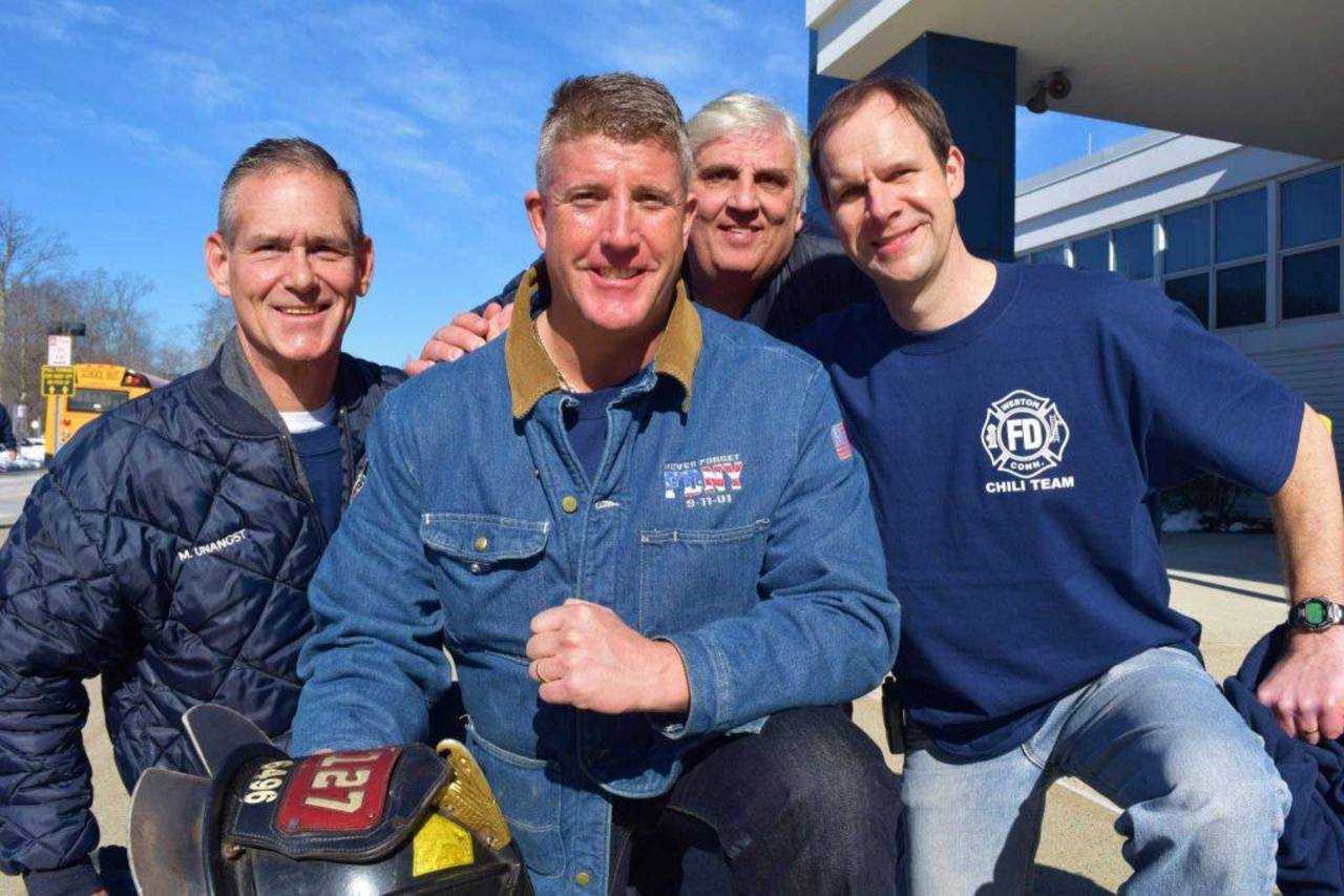 Ray Cooney from 'Firehouse Kitchen' gives his support to the Weston team members for their chili.