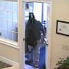 The suspect in the robbery of the Fairfield County Bank on Route 7 in Wilton at the front door.
