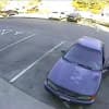 The suspect in the Wilton bank robbery with his car, a 1997 four-door Honda Accord.