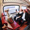 The Stanley Cup rides on a New Haven Line train from New York City to Stamford.