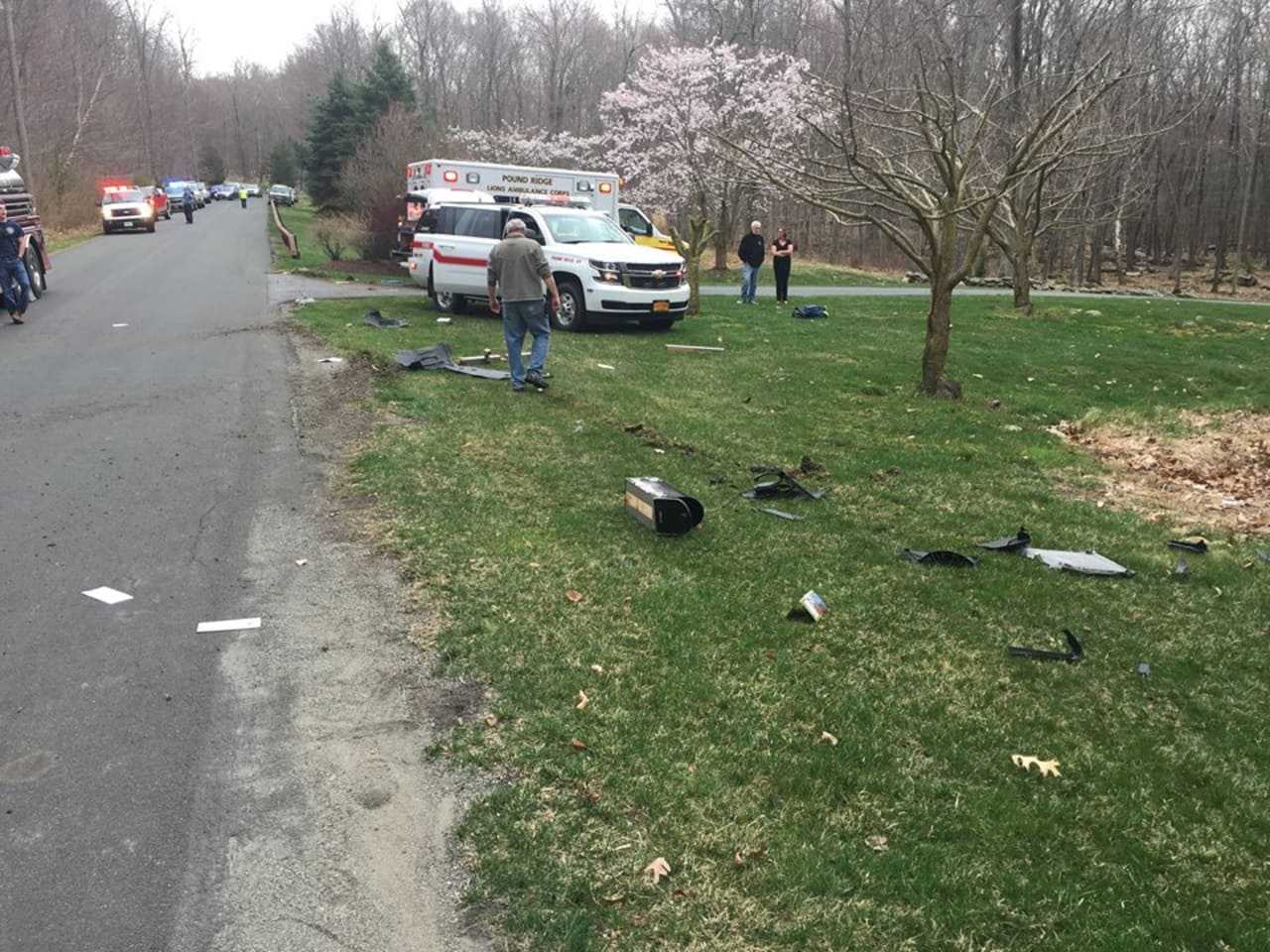 Debris from the car crash was thrown across the roadways and nearby yards.