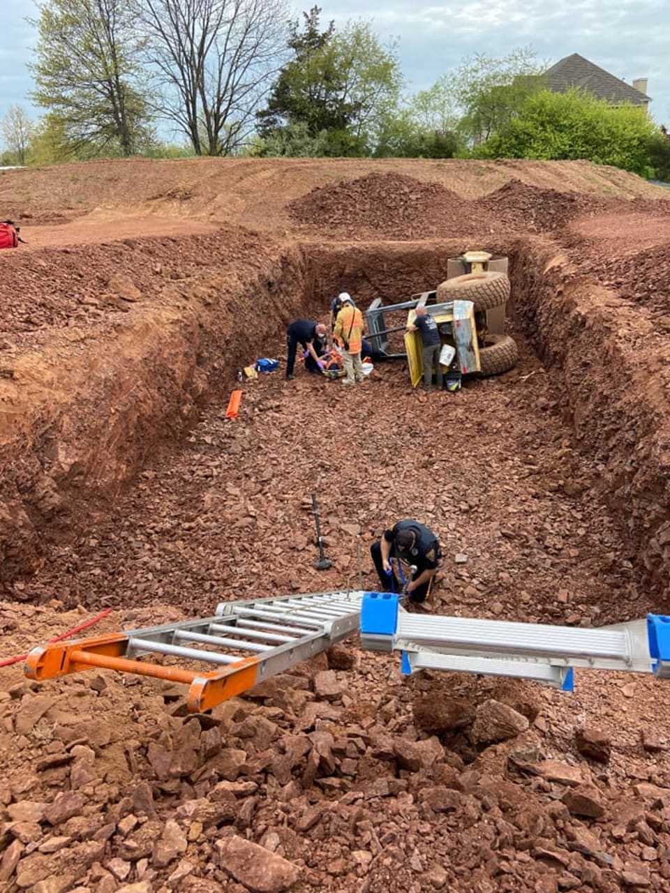 Emergency crews were called to a construction site on Robin Hill Way in Raritan Township shortly after 10:40 a.m. on a report that a soil machine had overturned into a septic system, authorities said.
