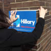 A supporter of Hillary Clinton's posts a sign outside SUNY Purchase's Performing Arts Center on Thursday morning. Clinton made her first New York primary stop in Westchester at the campus in Harrison.