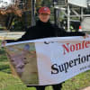 Amy Atkinson, left, and Val Devine demonstrate across the street from The Commons in Saddle River Saturday afternoon.