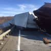 A tractor-trailer lost control and crashed on I-84.