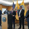Maron, at right, with various officials at a news conference in Teaneck last Sunday.