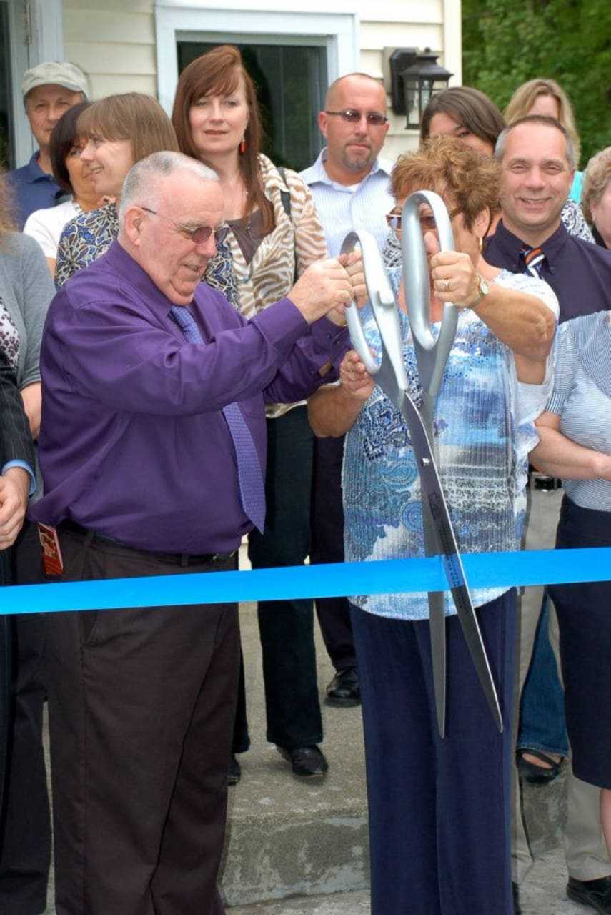 The owners of Jospeh's Steakhouse cutting the ribbon for its grand  opening in 2011.